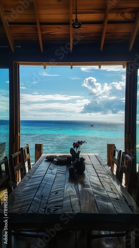 A dining table with a view of the ocean