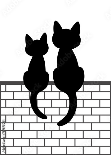 On an wall there are two cats sitting