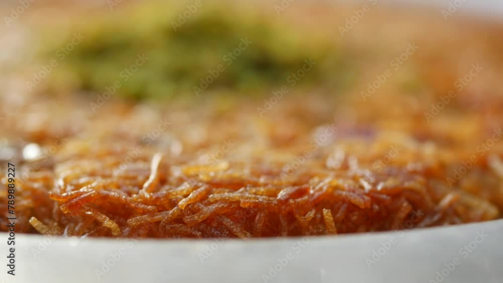 kunafa with a wipe cream on a plate . kunafa with a wipe cream on a plate .