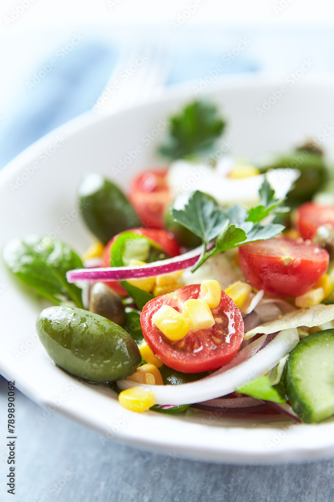 Simple Salad with Green Olives, Cucumber and Cherry Tomatoes. Bright wooden background. Simple Salad with Green Olives, Cucumber and Cherry Tomatoes. Bright wooden background.