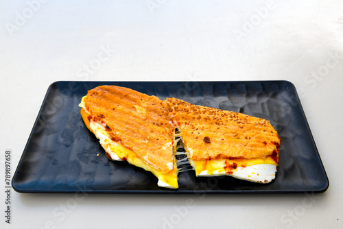 Turkish karisik atom  tost ( kasarli bazlama tost) . Sucuklu, Kasarli, kavurmali karisik tost. Flat baked bread toasted photo