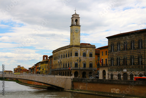 View of the ancient building Palazzo Pretorio on the banks of the Arno river in the municipality of Pisa