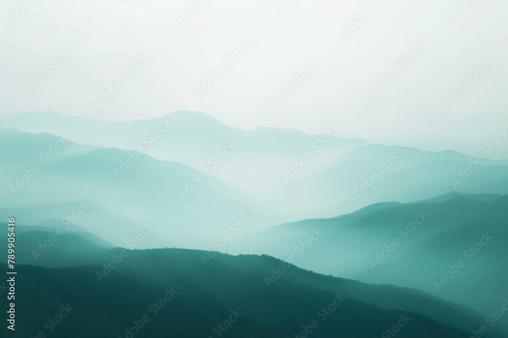 Layers of Mountain Ridges in Misty Shades of Green During Early Morning Light