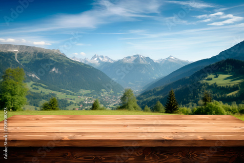 Empty wooden table for  product display showcase with blurred green alpine meadows , hills  and mountains  background © KEA