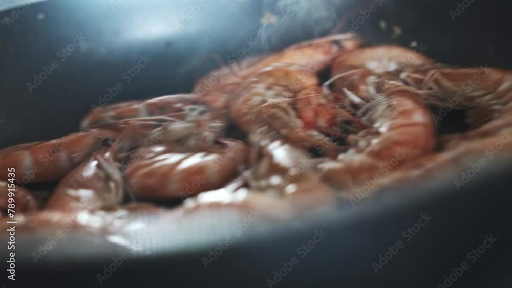 Close-Up of Cooking, Preparing Royal Shrimps in Hot Pan Closeup of King Prawns Frying with Steam in Slow Motion. Macro Sea food Preparation, Eating Meal Concept Close-Up of Cooking, Preparing Royal Shrimps in Hot Pan Closeup of King Prawns Frying with Steam in Slow Motion. Macro Sea food Preparation, Eating Meal Concept
