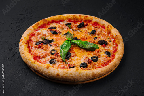Fresh italian pizza with basil and olives