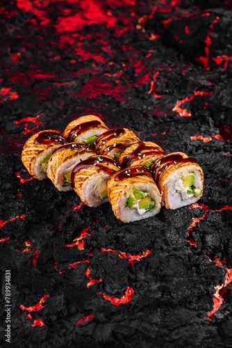 Sushi rolls over lava-like texture