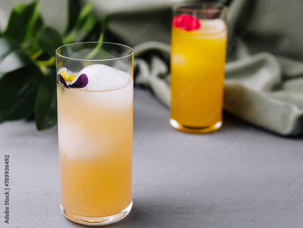 Elegant cocktails with floral garnish Elegant cocktails with floral garnish