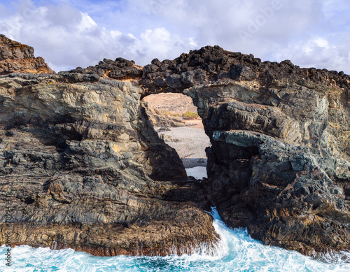 Stunning Pena Horadada rock arch arco near Ajuy village Betancuria Fuerteventura Canary Islands Spain