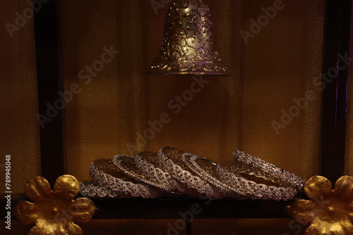 stone studded bangles spread on lot lit area