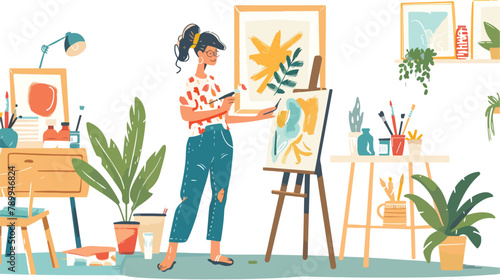 Smiling woman painting at home holding paint brush