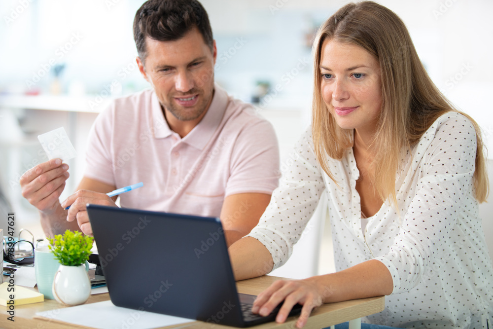 couple using credit card shopping online