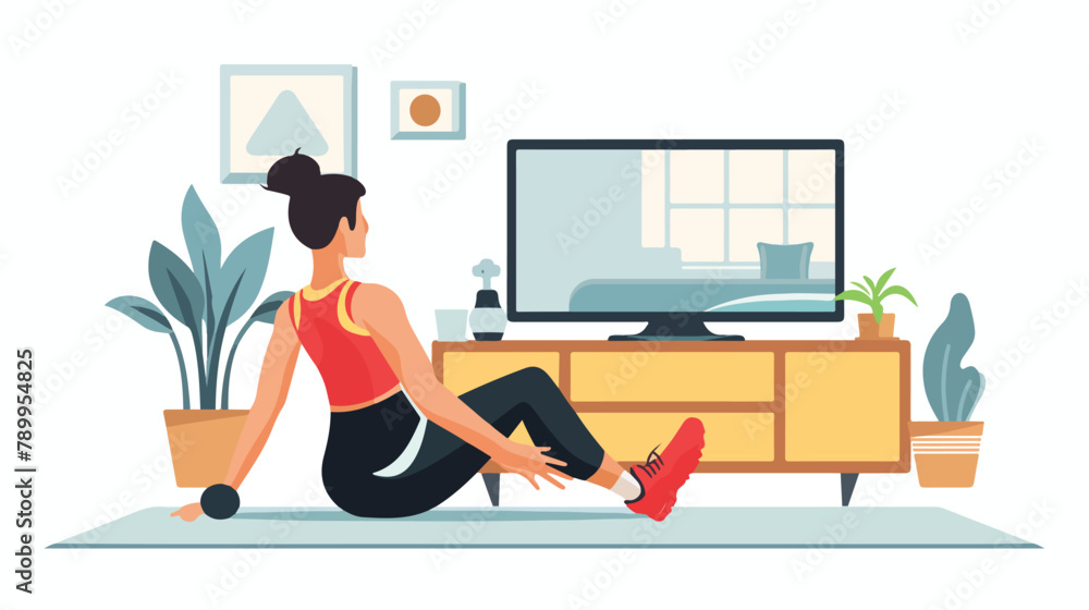 Woman training while watching fitness program home 