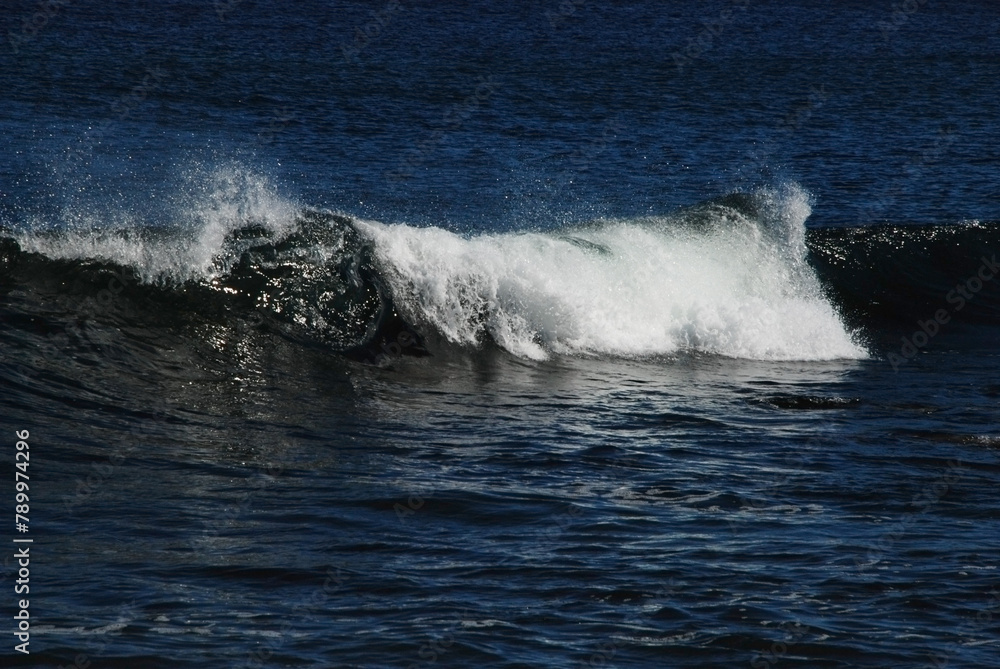 waves at the sea shore, rollingon blue ocean water, white cap waves at the sea shore, rollingon blue ocean water, white cap