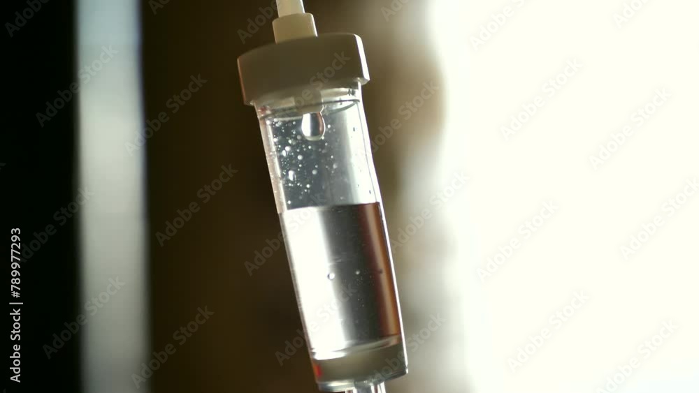 dropper with anesthesia dripping. the drug drips drop by drop, close-up dropper with anesthesia dripping. the drug drips drop by drop, close-up