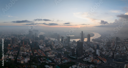 Aerial drone skyline video of Saigon cityscape at sunrise in District 1, with Sai Gon river view © Hanoi Photography