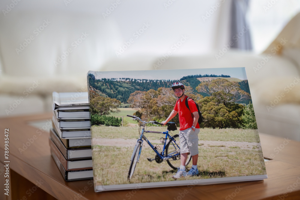 Photobook of family holiday trips with piles of photo albums on the coffee table.