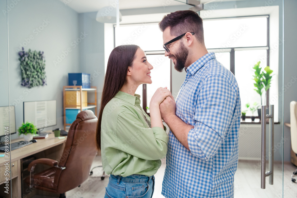 Obraz premium Photo of two happy business people partners feel strong love each other team building in workstation