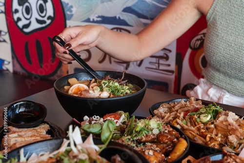 Woman eating ramen at a Japanese restaurant in Perth, Australia