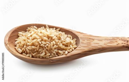 Tokyo brown rice on a wooden spoon isolated on a white background.