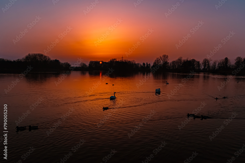 Sunset with reflections near Plattling, Isar, Deggendorf, Bavaria, Germany Sunset with reflections near Plattling, Isar, Deggendorf, Bavaria, Germany