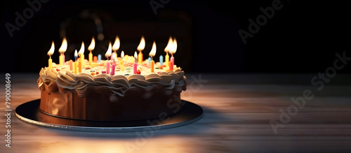 Close-up of a birthday cake with burning candles on a dark background, isolate. AI generated.
