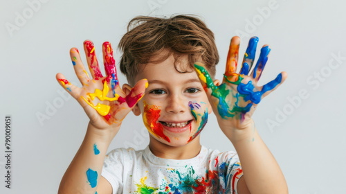 Young child in paint splattered shirt  great for active play and developmental growth.