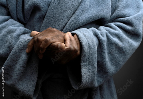 praying to god with hands together Caribbean man praying on black background with people stock photos stock photo stock image