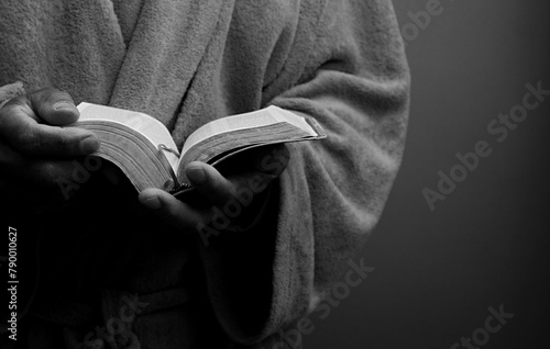 praying to god with hands together Caribbean man praying on black background with people stock photos stock photo stock image