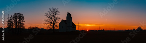 Sunset with a church silhouette at Huett, Eichendorf, Dingolfing-Landau, Bavaria, Germany