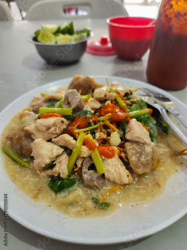 Mie Kering or Mie Titi is one of the most famous Makassar dishes. Mie Titi served with thick gravy and sliced chicken, shrimp, mushrooms, liver, and squid