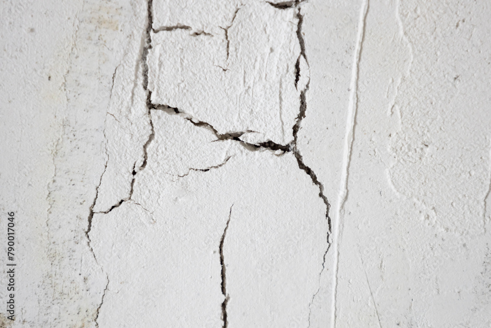 Obraz premium The plaster with cracked wall background