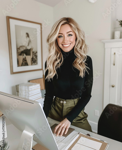 Woman Standing in Front of Laptop Computer