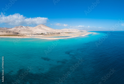 Stunning mid level aspect aerial panoramic view of the beautiful tropical looking beach, lagoon and sand dunes at Sotavento Risco del Paso beach near Costa Calma on Fuerteventura Canary Islands Spain