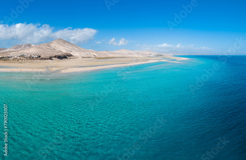 Stunning mid level aspect aerial panoramic view of the beautiful tropical looking beach, lagoon and sand dunes at Sotavento Risco del Paso beach near Costa Calma on Fuerteventura Canary Islands Spain photo