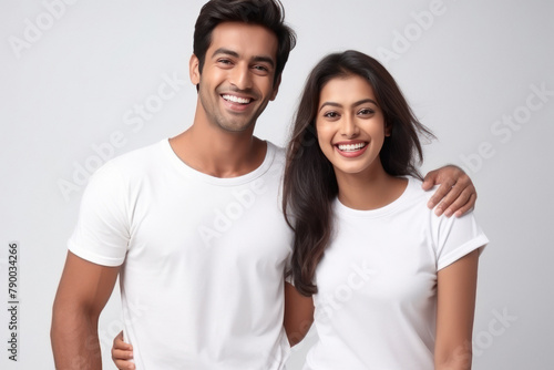 young indian couple standing on white background