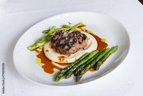 Appetizing medallions with mashed potatoes and asparagus. Restaurant serving, banquet, food photography