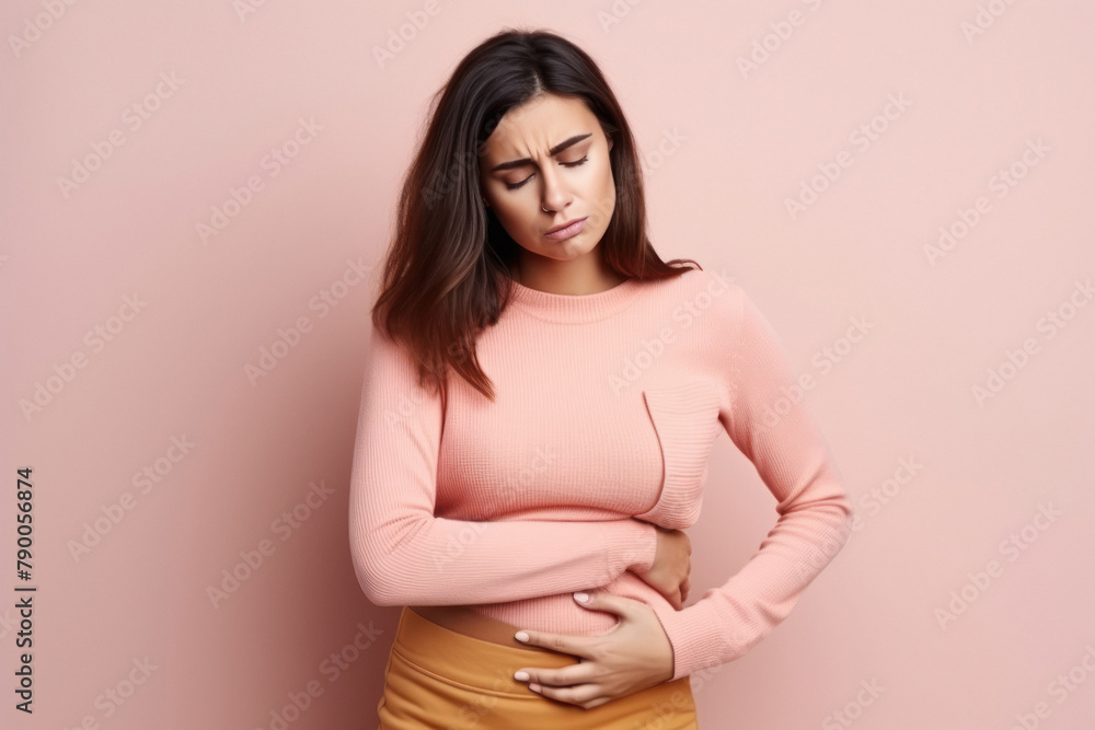 young beautiful woman suffering from stomach cramp young beautiful woman suffering from stomach cramp