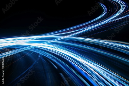 Dynamic blue and white light trajectories on a dark backdrop with long exposure photo