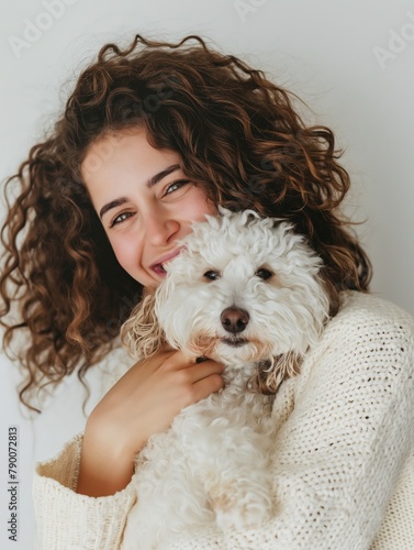 Warm portrait of a young woman hugging her fluffy white dog, expressing joy and affection.