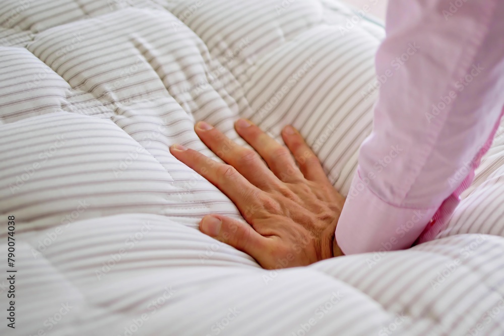 Obraz na plátně Hand testing memory foam mattress topper