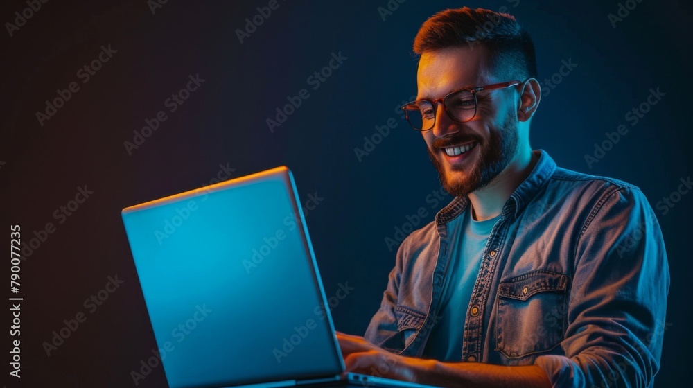 Smiling Man with Glowing Laptop Smiling Man with Glowing Laptop