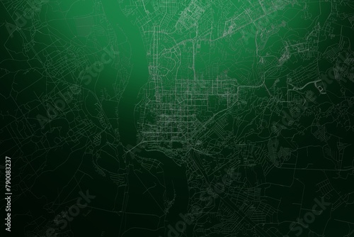 Street map of Tomsk (Russia) engraved on green metal background. Light is coming from top. 3d render, illustration photo