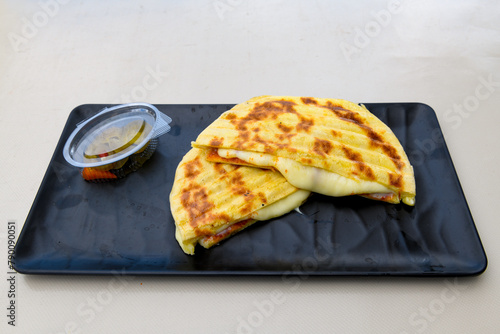 Turkish karisik atom  tost ( kasarli bazlama tost) . Sucuklu, Kasarli, kavurmali karisik tost. Flat baked bread toasted photo