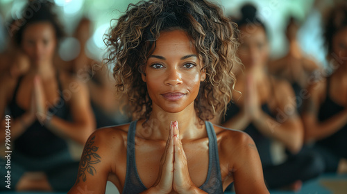 yoga instructor looking at camera during a yoga class