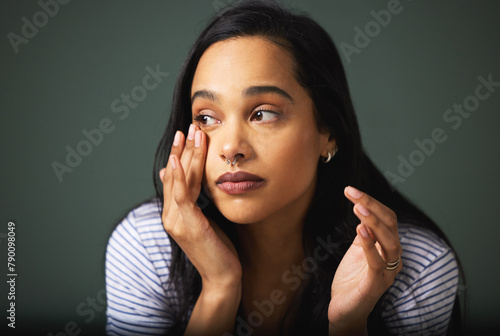 Crying, sad woman or thinking of depression in studio for burnout, trauma or mistake with fear, grief or tears. Frustrated, anxiety or girl worried by bad news or loss isolated on grey background