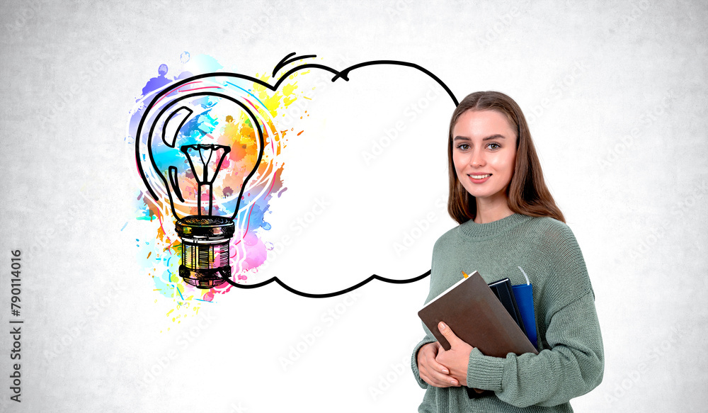 Smiling woman student with notebooks, colorful lightbulb and empty thought bubble Smiling woman student with notebooks, colorful lightbulb and empty thought bubble