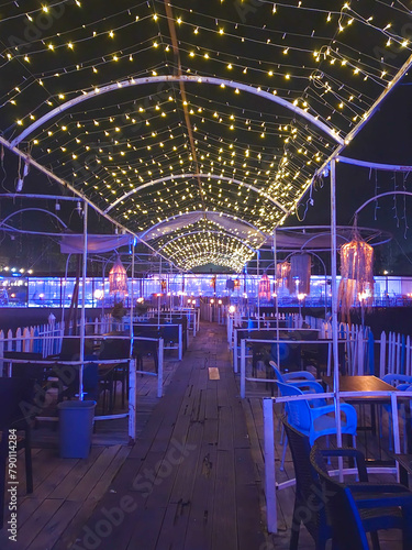 Night view of a restaurant decorated with blue lights, closeup of photo