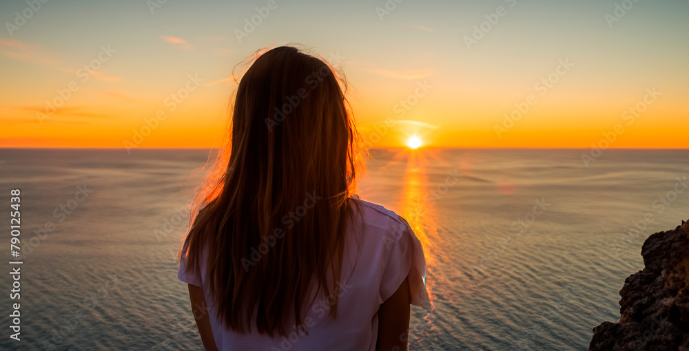 a woman watching a sunset on a torpical beach generated with artificial intelligence