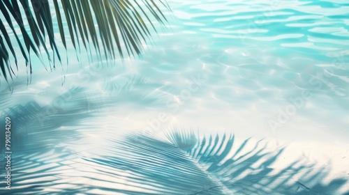 Beautiful abstract background concept banner for summer vacation at the beach with palm leaf shadows on the abstract white sand beach background  and sun lights on the water surface.